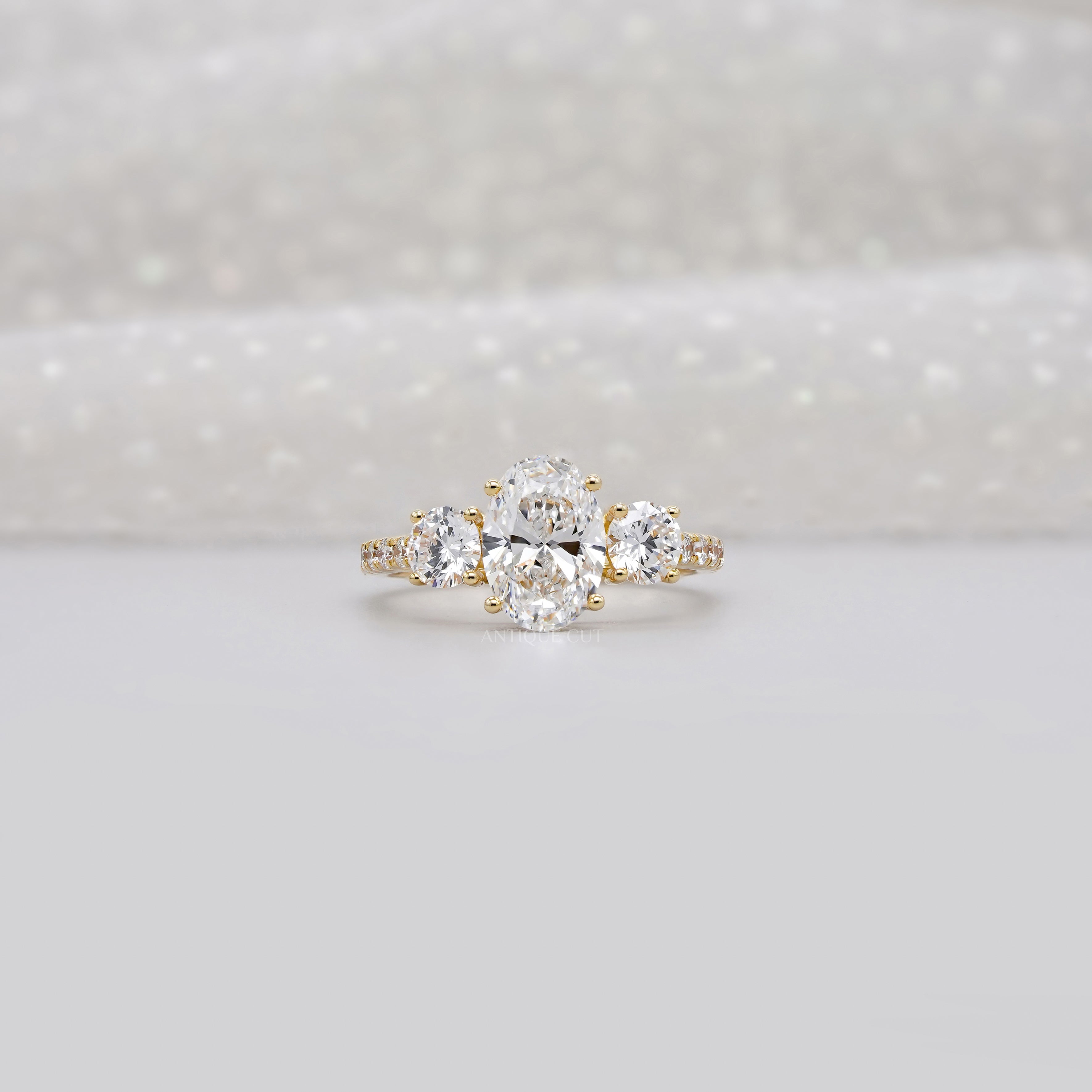 2.40tcw Oval & Round Lab-Grown Diamond Ring | Three-Stone Trellis Setting | IGI Certified