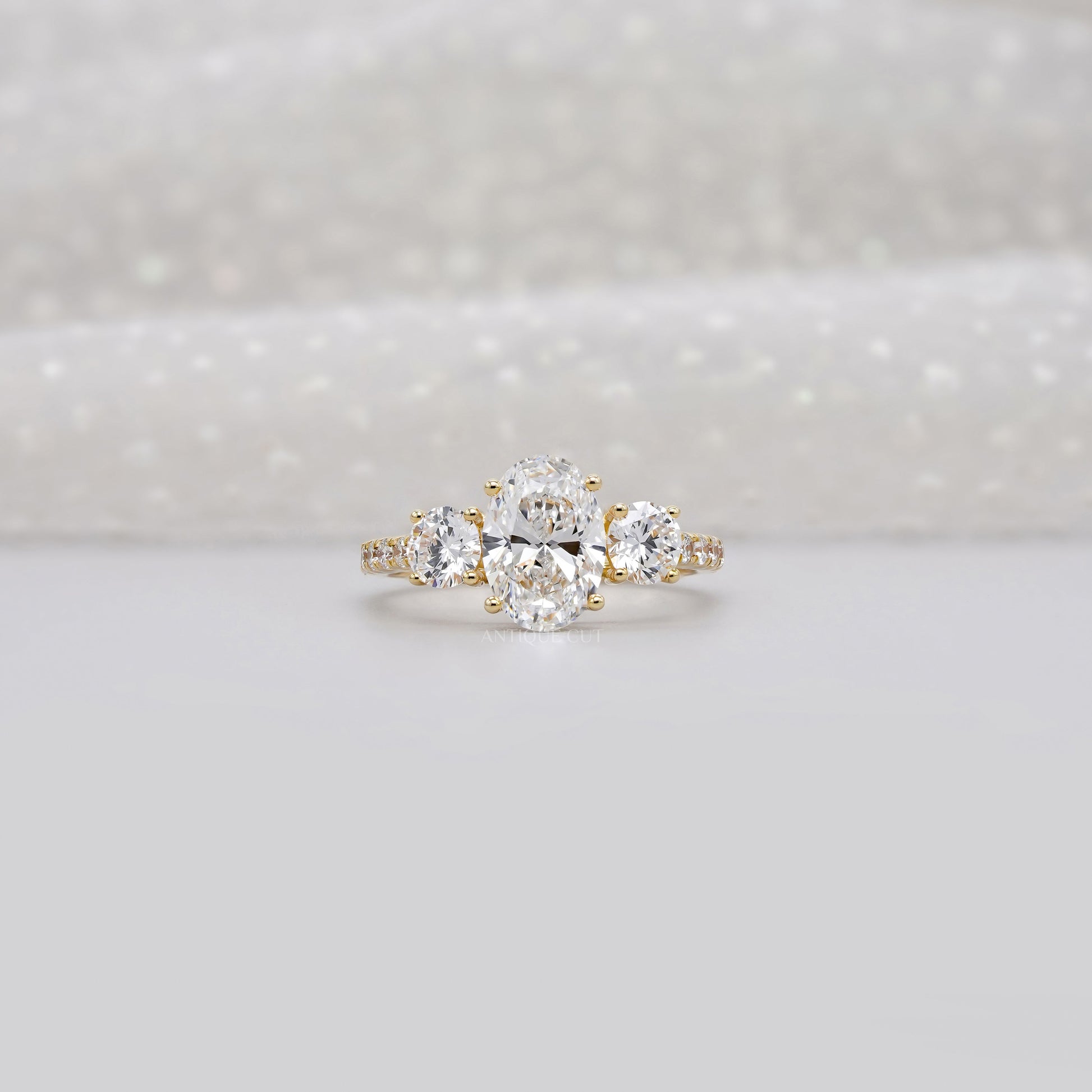 2.40tcw Oval & Round Lab-Grown Diamond Ring | Three-Stone Trellis Setting | IGI Certified