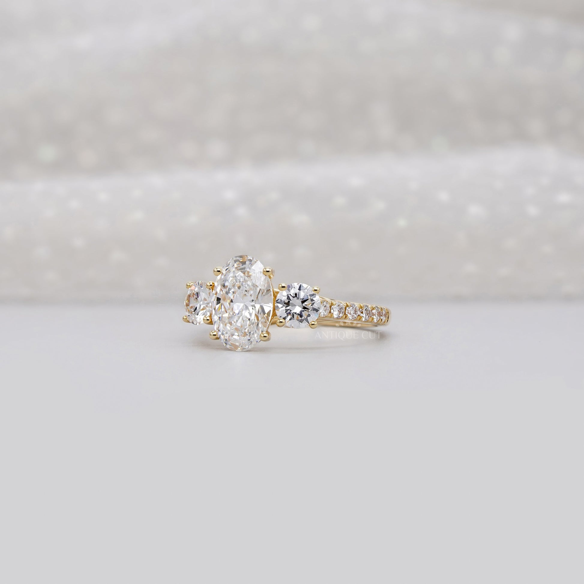 2.40tcw Oval & Round Lab-Grown Diamond Ring | Three-Stone Trellis Setting | IGI Certified