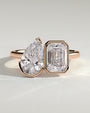 Rose :: Calvellae 3.3ct pear and 3.3ct emerald bezel toi et moi lab grown diamond engagement ring IGI certified rose gold