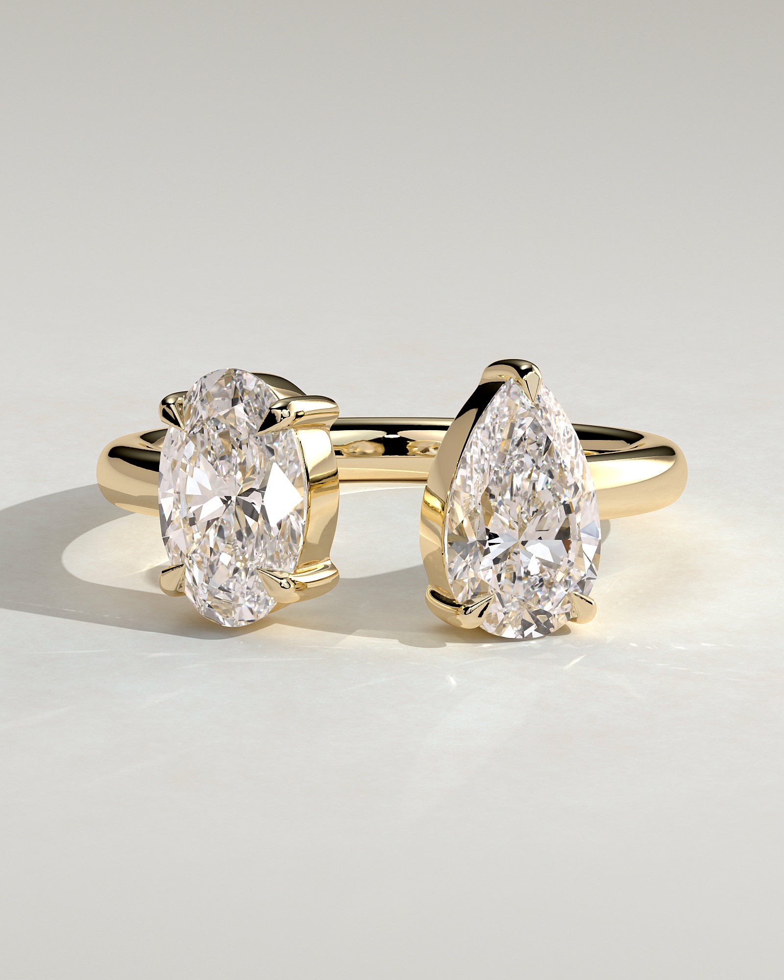 Yellow :: Noriquea oval and pear toi et moi lab grown diamond engagement ring IGI certified yellow gold