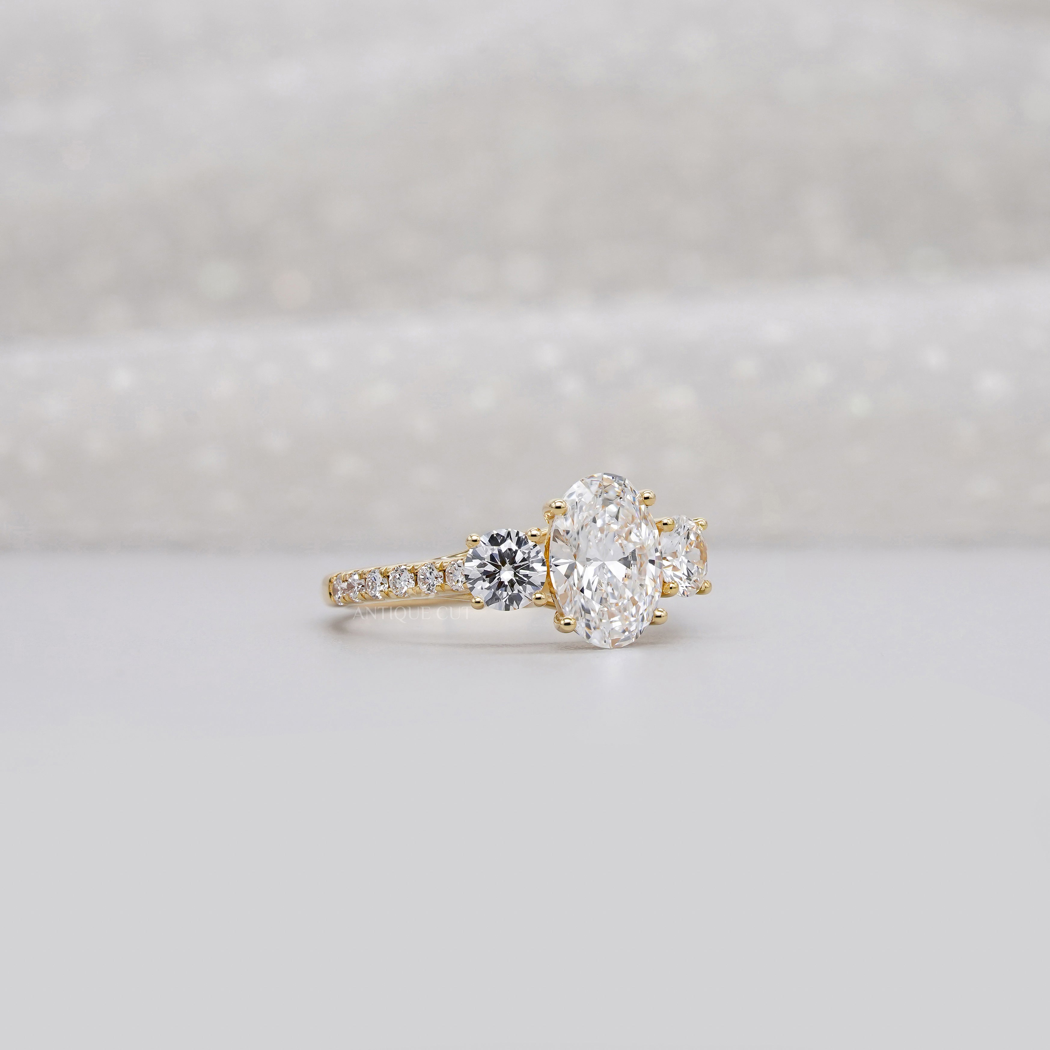 2.40tcw Oval & Round Lab-Grown Diamond Ring | Three-Stone Trellis Setting | IGI Certified