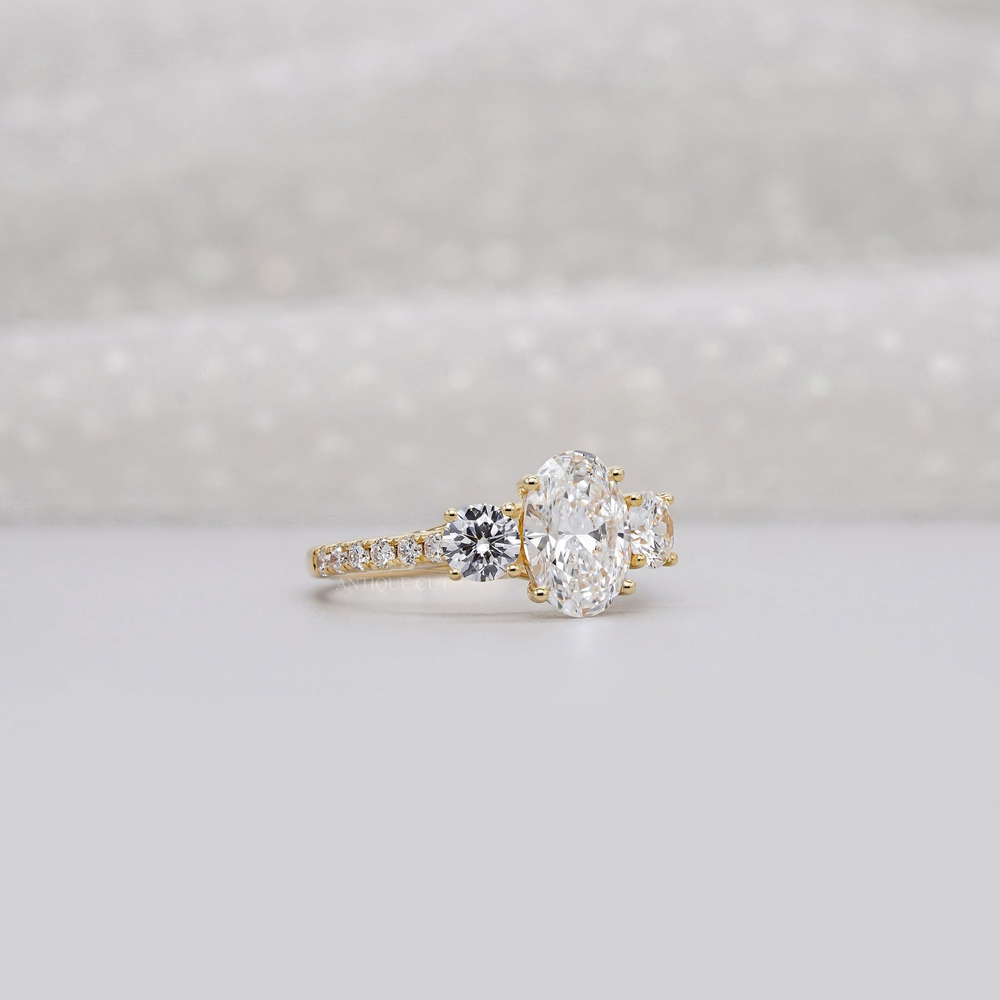 2.40tcw Oval & Round Lab-Grown Diamond Ring | Three-Stone Trellis Setting | IGI Certified