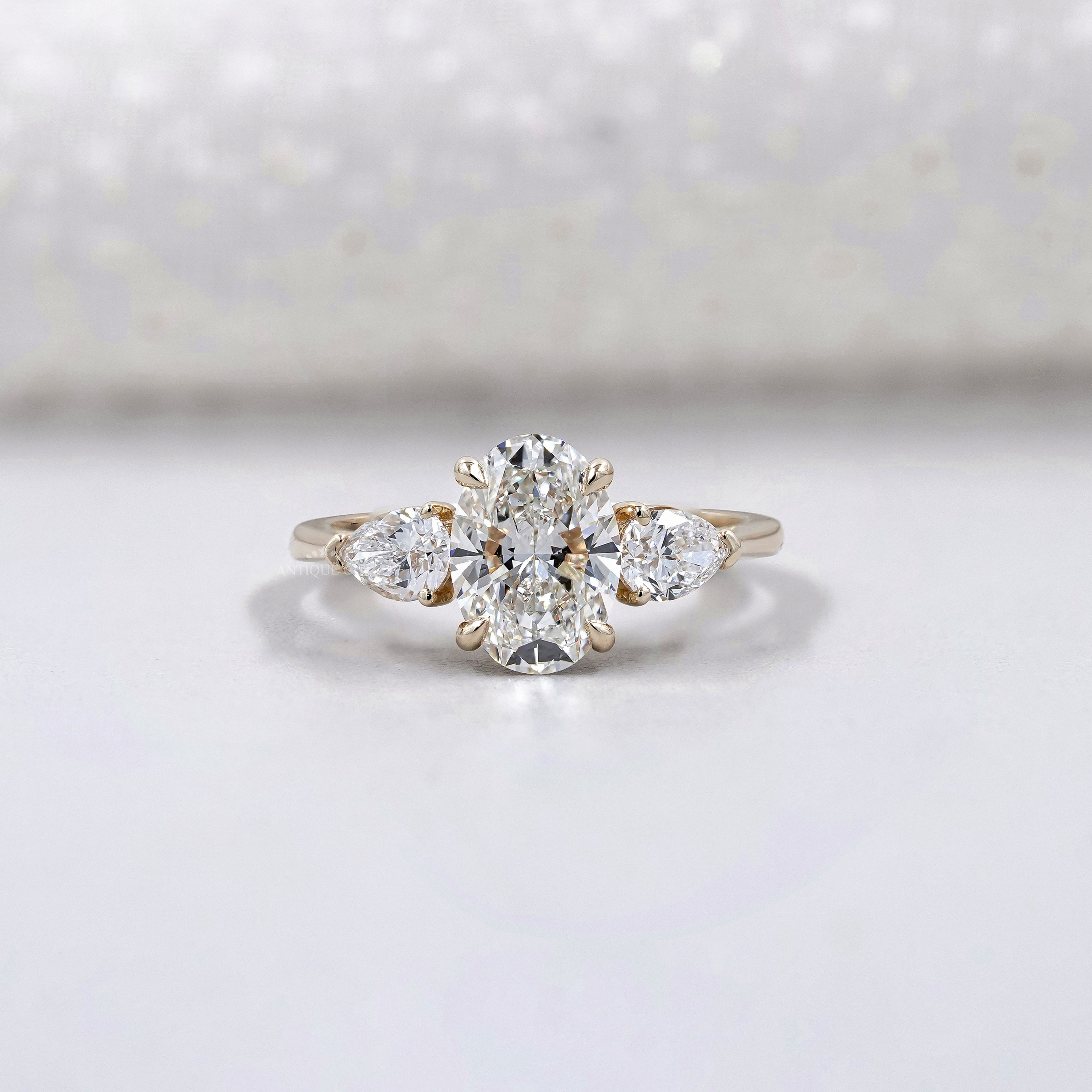 Oval Cut 2.00tcw Lab Grown Diamond Engagement Ring | Three Stone Pear Side Design | IGI Certified