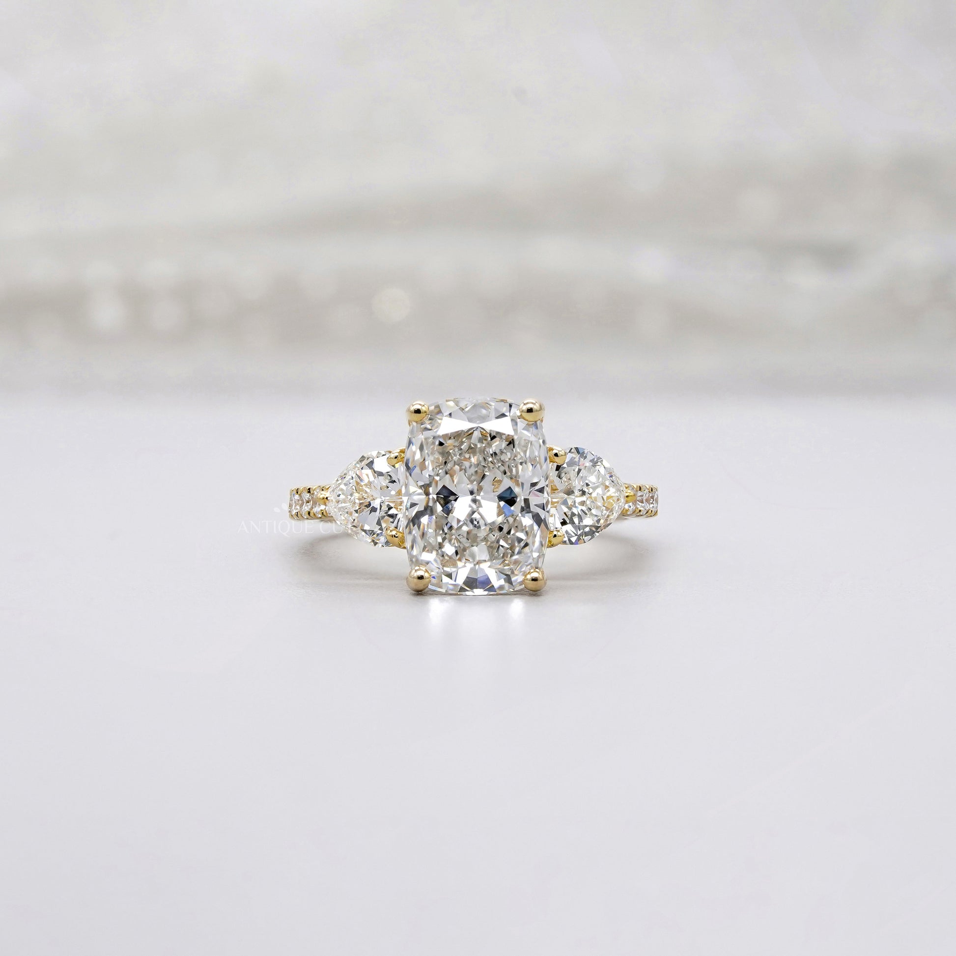 Cushion 3.90tcw Lab-Grown Diamond Three-Stone Ring | Heart & Round Side Stones | Yellow Gold