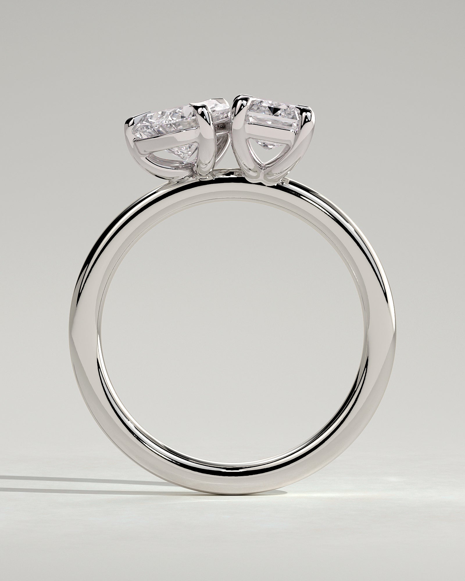 White :: close up pear and emerald lab grown diamond toi et moi ring white gold brilliant contrast