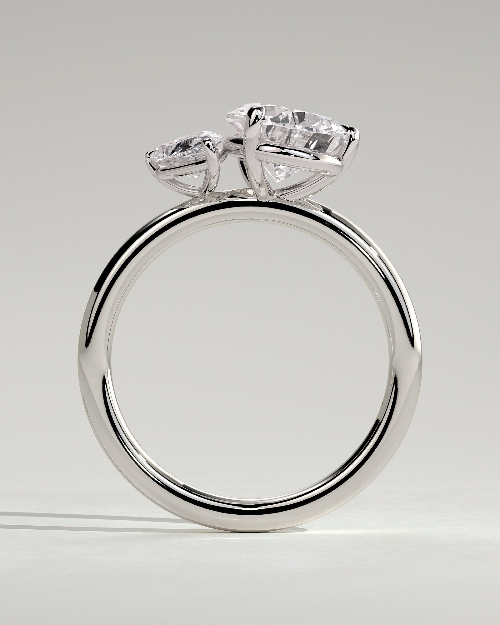 White :: close up 0.5ct and 1.25ct pear lab grown diamond toi et moi ring white gold asymmetrical sparkle