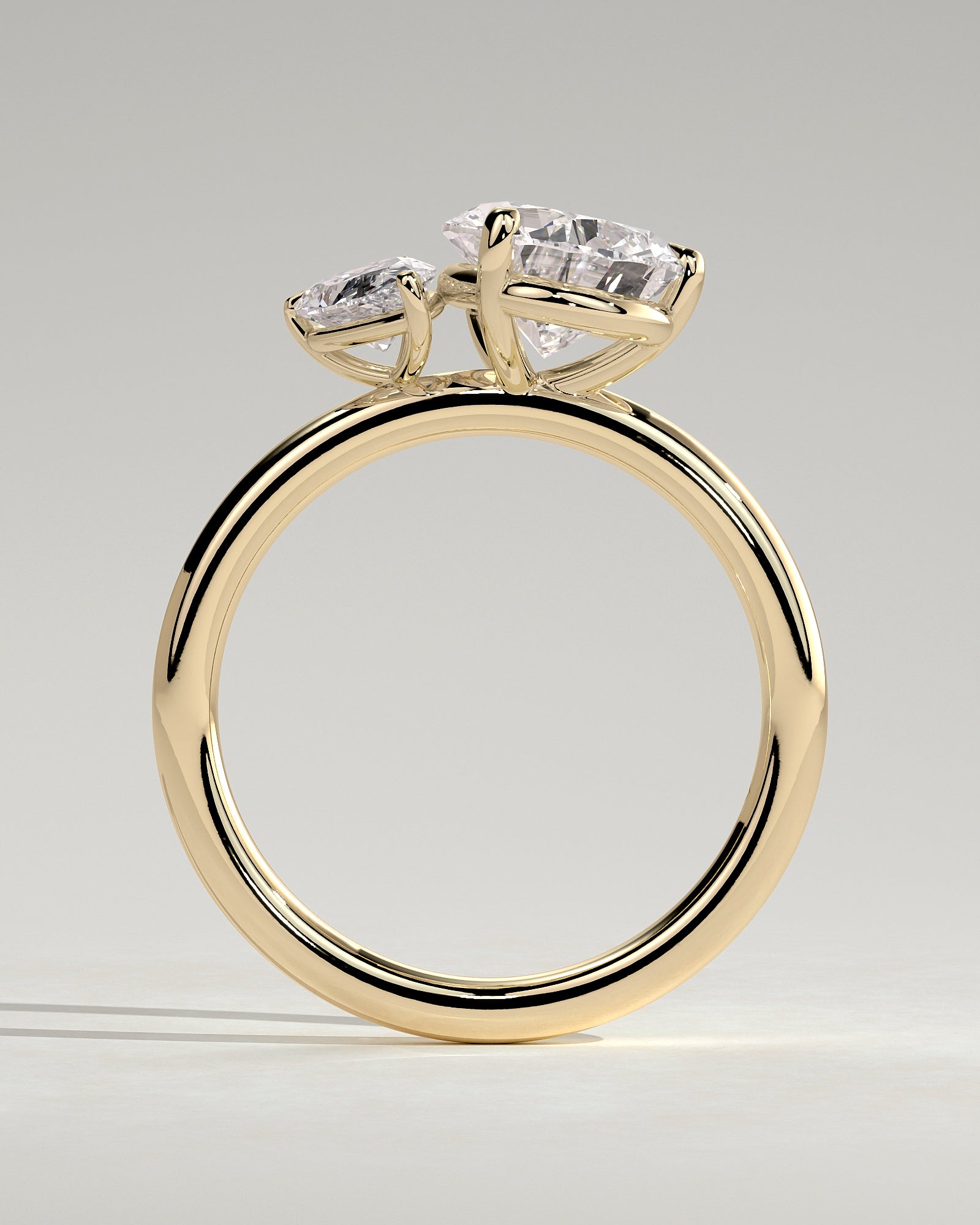 Yellow :: close up 0.5ct and 1.25ct pear lab diamond toi et moi ring yellow gold asymmetrical brilliance
