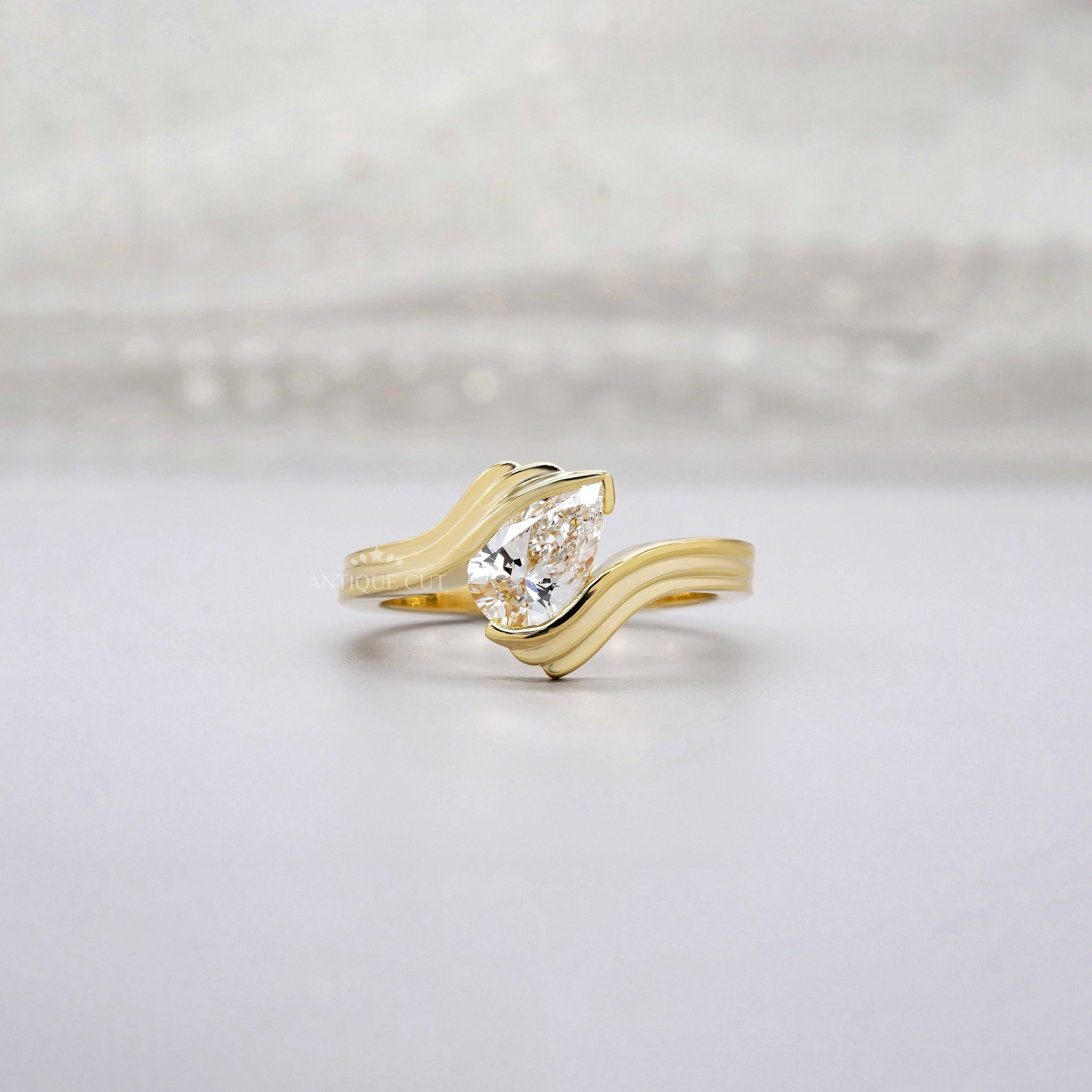 1.00ct Pear Lab Diamond Wave Solitaire Ring | Sculpted Yellow Gold | IGI Certified