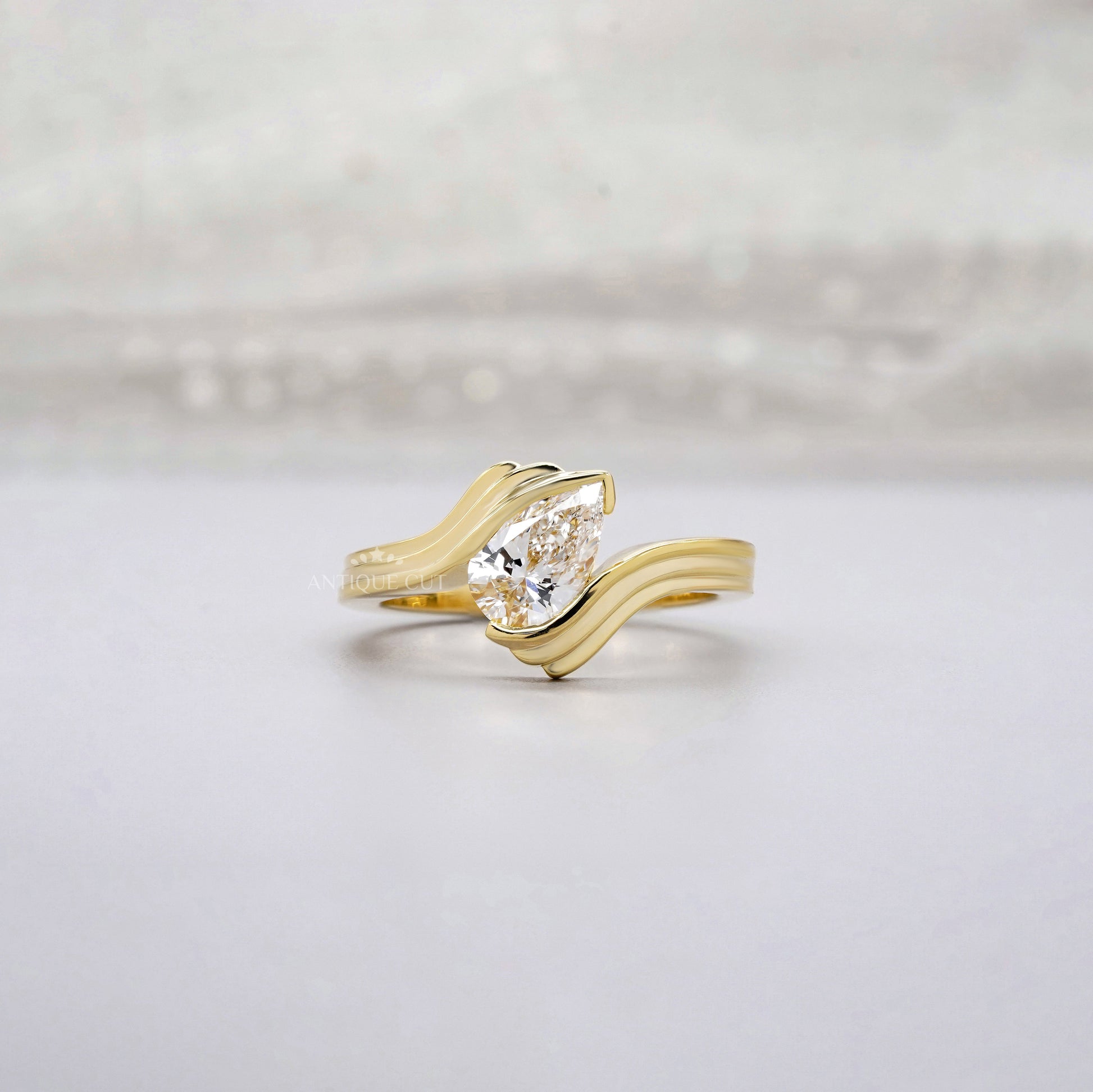 1.00ct Pear Lab Diamond Wave Solitaire Ring | Sculpted Yellow Gold | IGI Certified