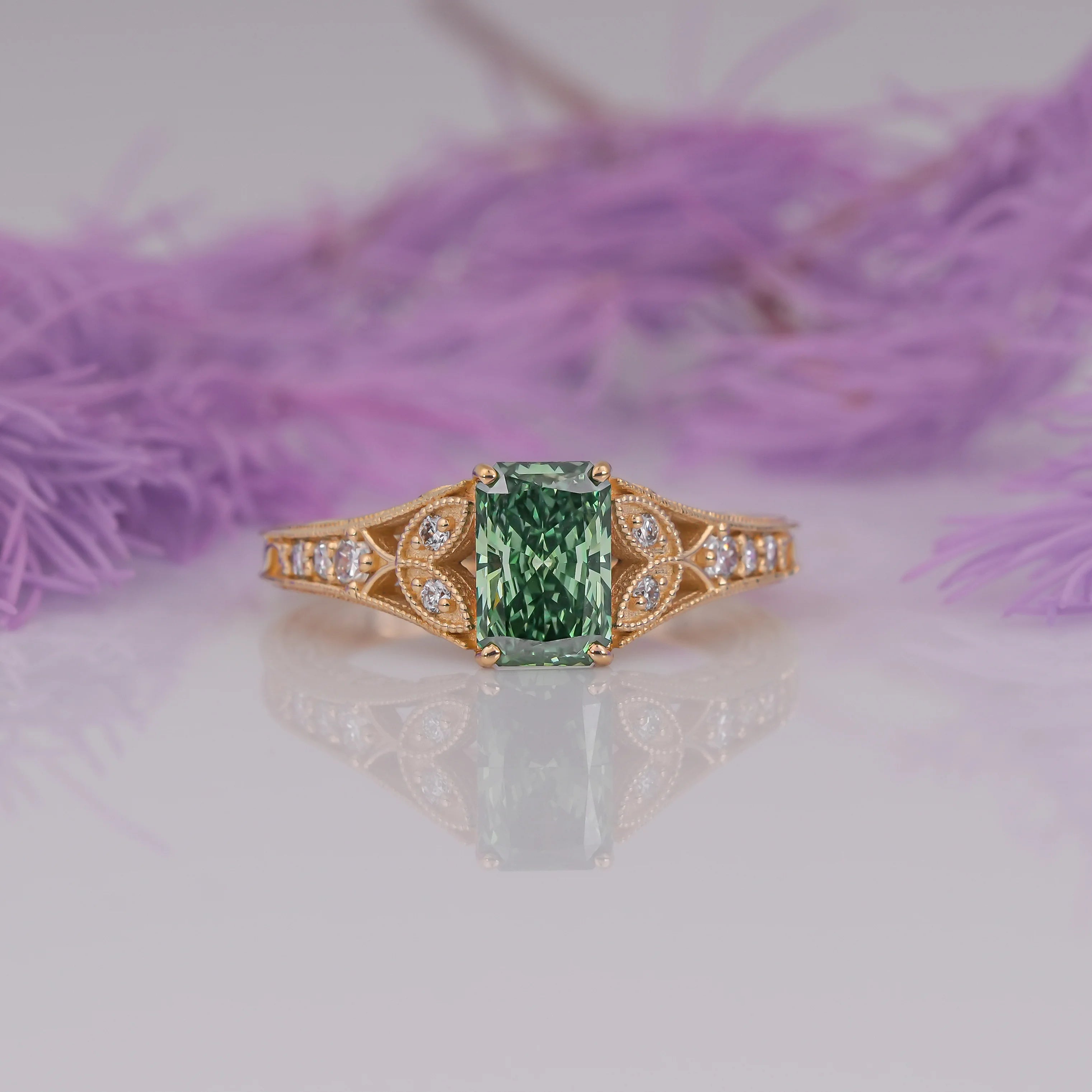 Common :: 1.15TCW green radiant lab grown diamond vintage engagement ring with round diamond accents.