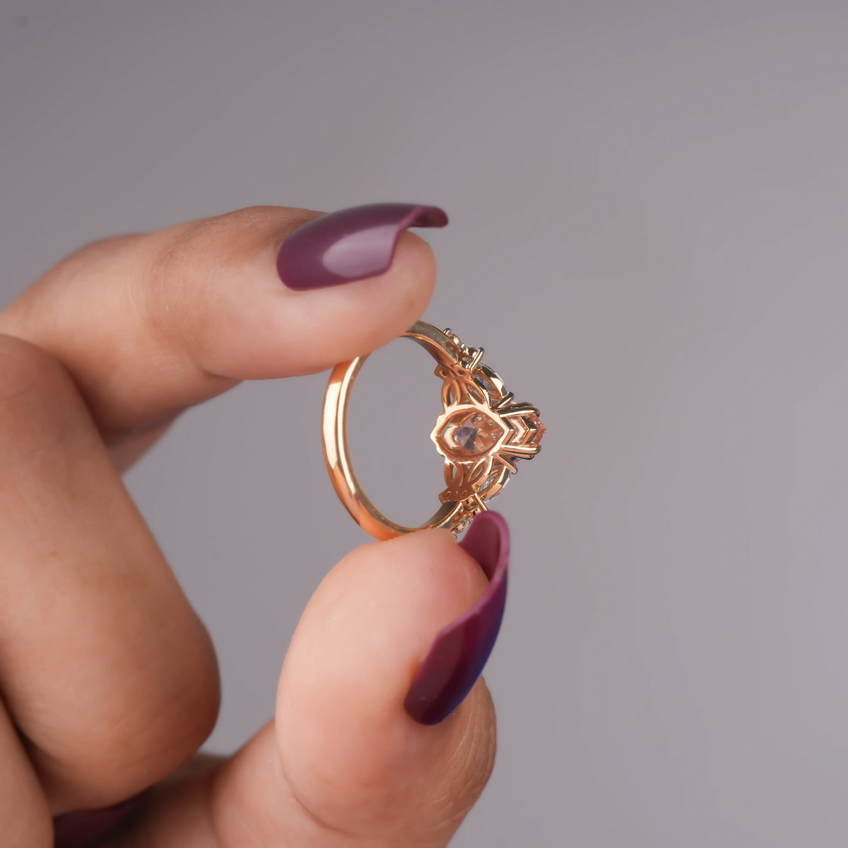 Common :: Elegant pink marquise engagement ring with 0.30TCW marquise and round accent diamonds on a slim 2MM band.