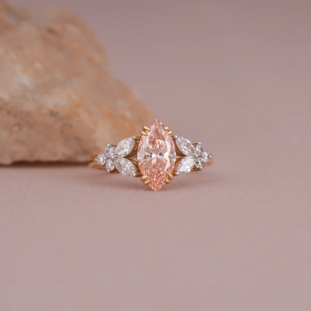 Common :: 1.30TCW pink marquise lab grown diamond nature-inspired engagement ring with marquise and round accents.