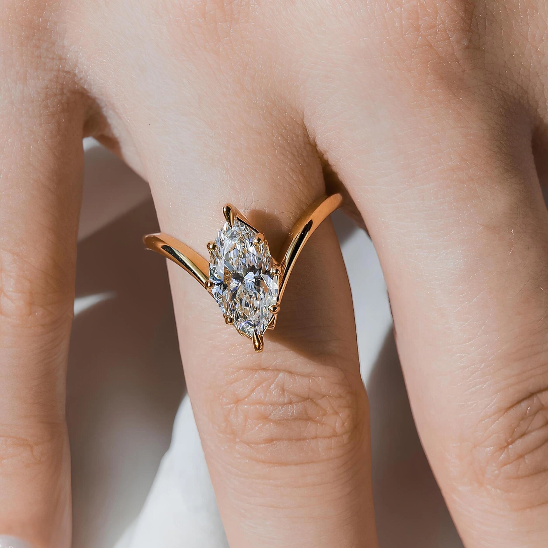 Common :: 1.55ct elongated Marquise diamond ring with sculptural sweeping shoulders