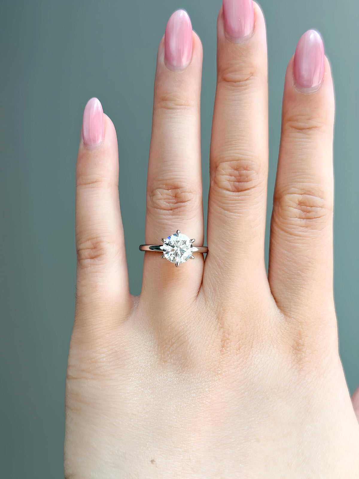 Common :: 1.35ct round lab grown diamond solitaire ring shown on hand