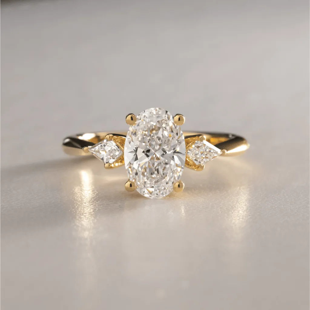 Common :: Unii Jewels 1.65ct oval lab grown diamond three stone engagement ring