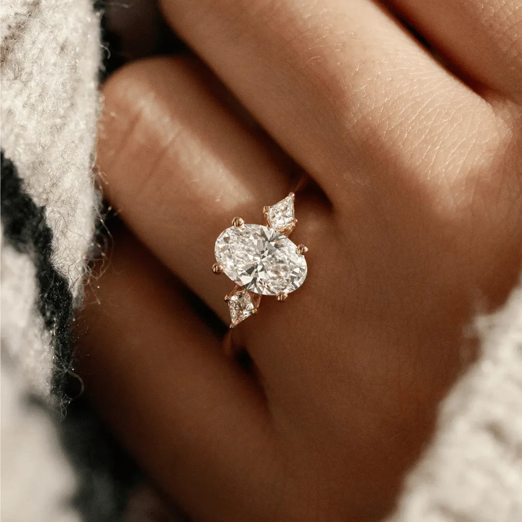 Common :: D color VVS1 oval lab grown diamond three stone engagement ring