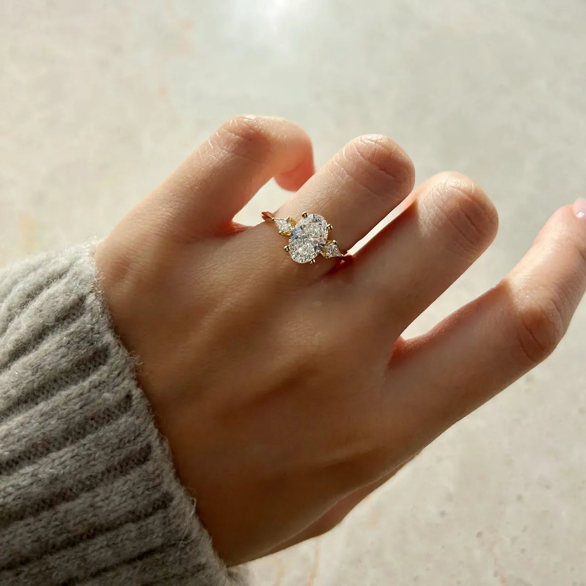 Common :: 1.65ct oval and kite shaped diamond three stone engagement ring