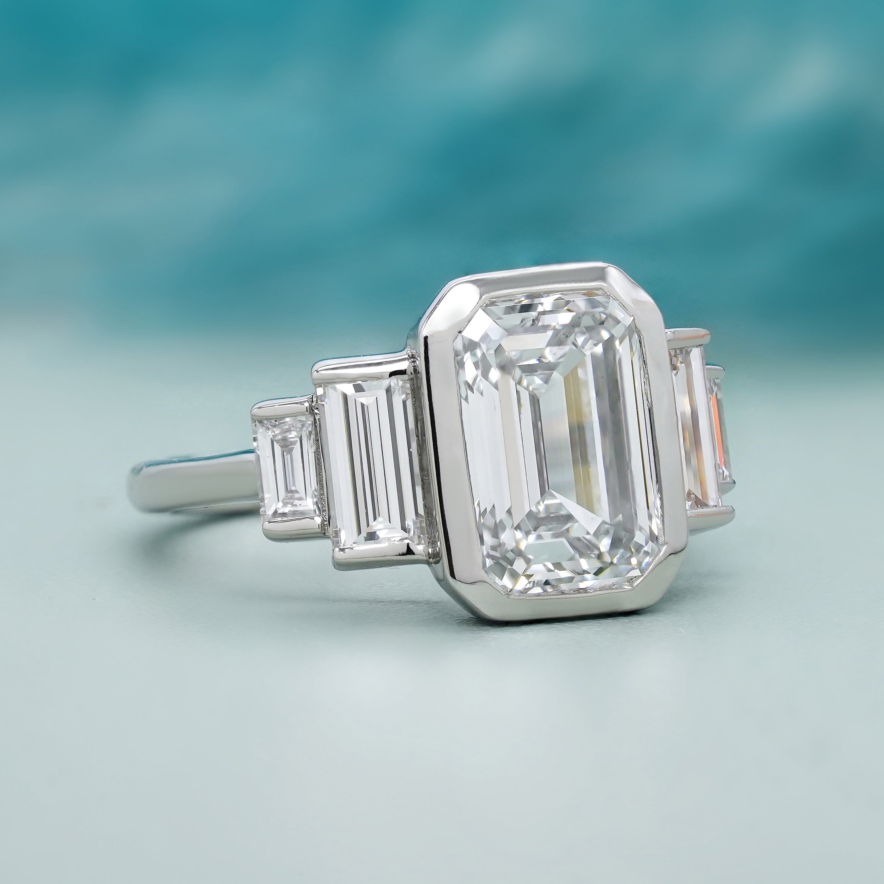 Emerald 4.00tcw Lab Grown Diamond, Bezel Set Three Stone Engagement Ring, D-E-F Color, VVS-VS Clarity, IGI Certificate