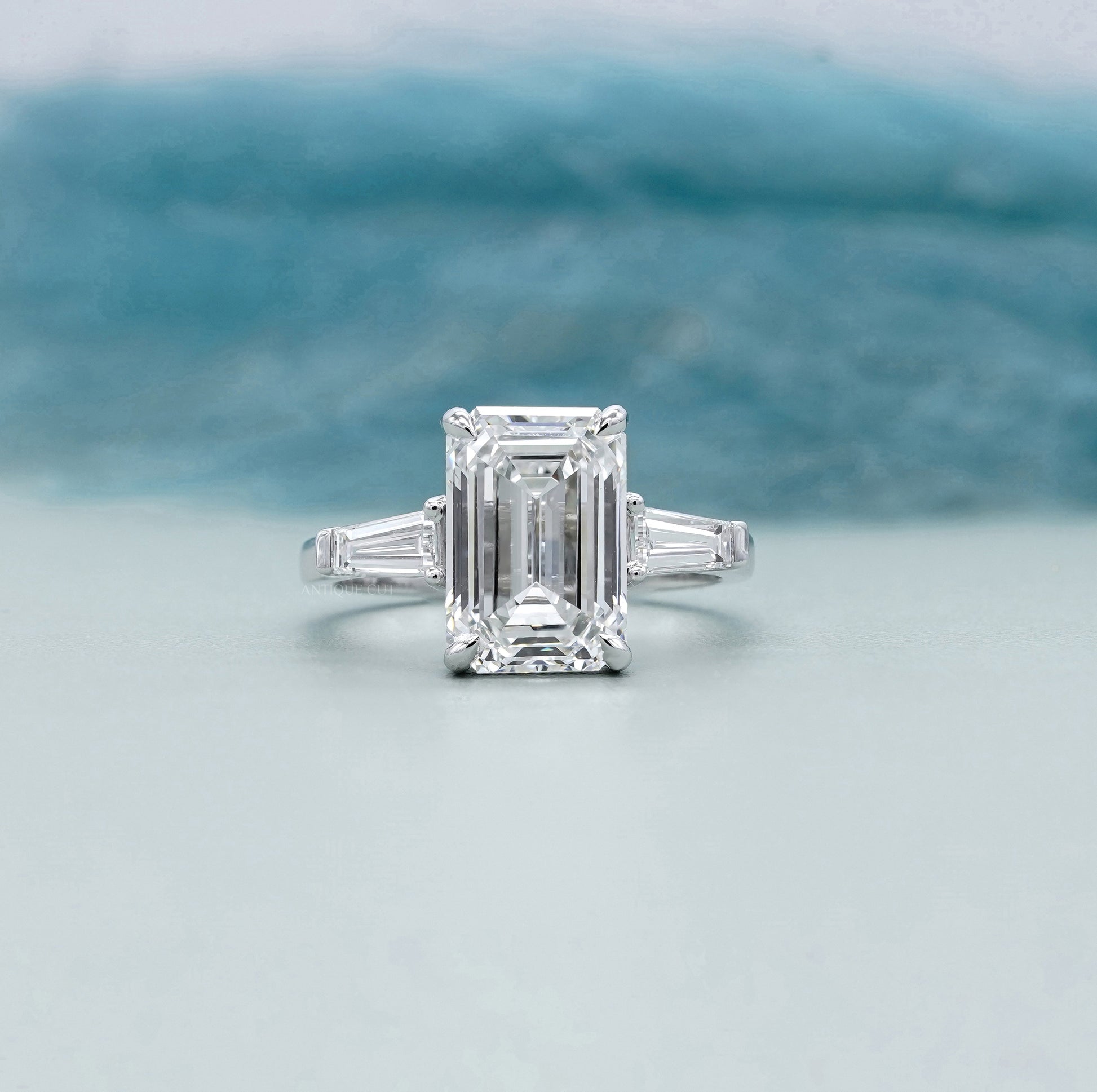 Emerald Cut 5.60tcw Lab Grown Diamond Three Stone Engagement Ring | Baguette Side Stones | Platinum/White Gold | IGI Certified