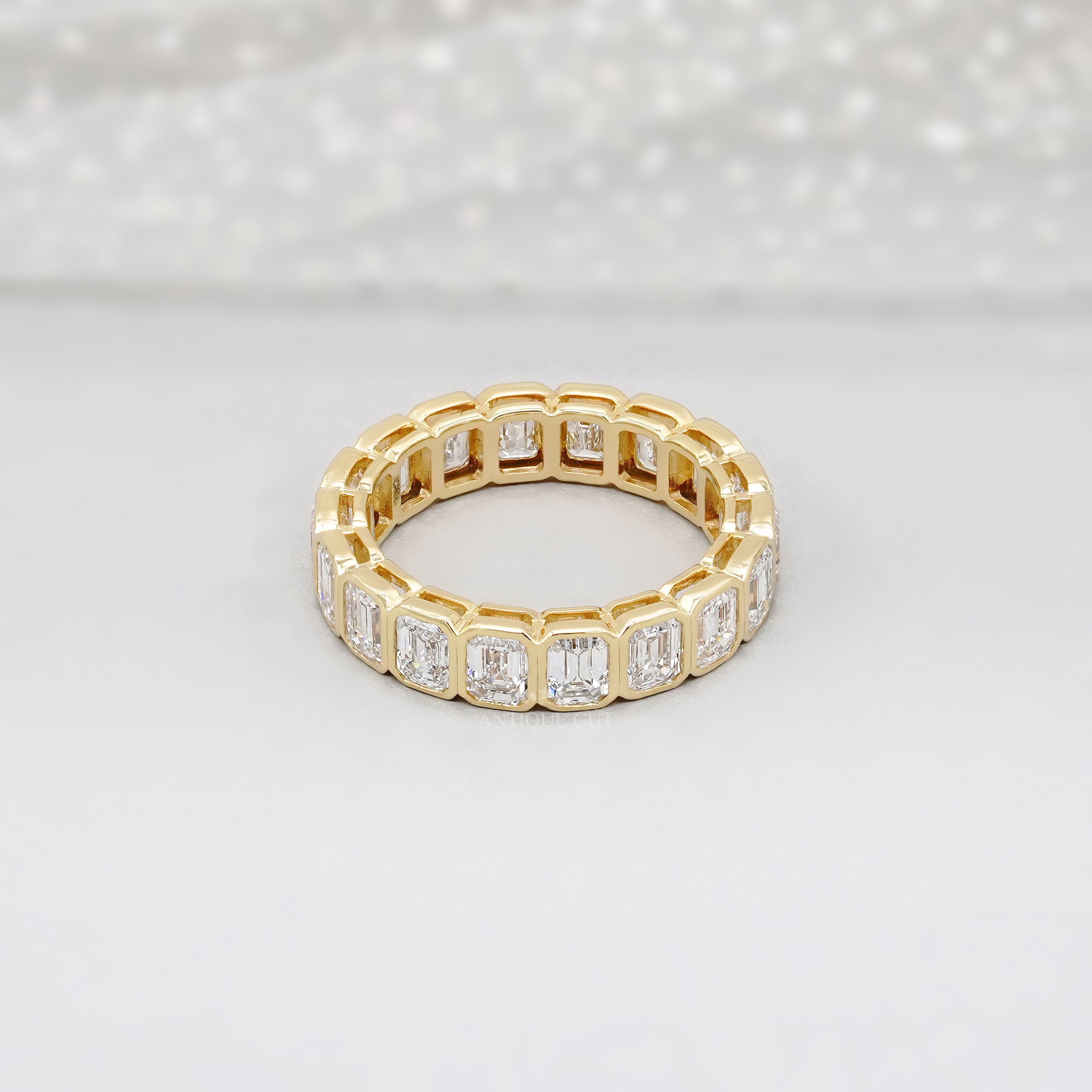 Emerald Cut 3.60tcw Lab Diamond Eternity Band | IGI Certified | Yellow Gold