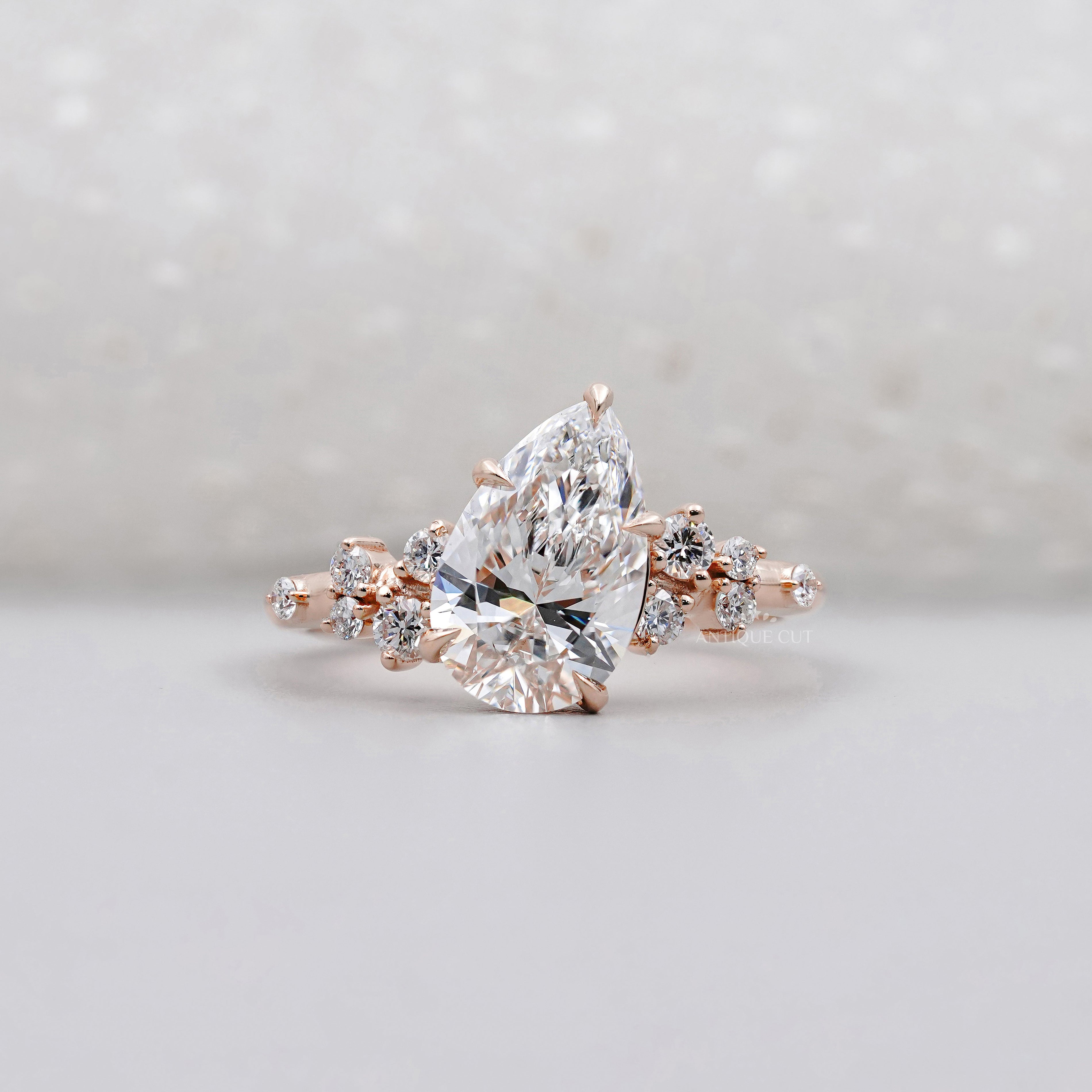 Pear Cut 2.30tcw Lab Diamond Engagement Ring | Rose Gold Cluster Side Stones IGI Certified