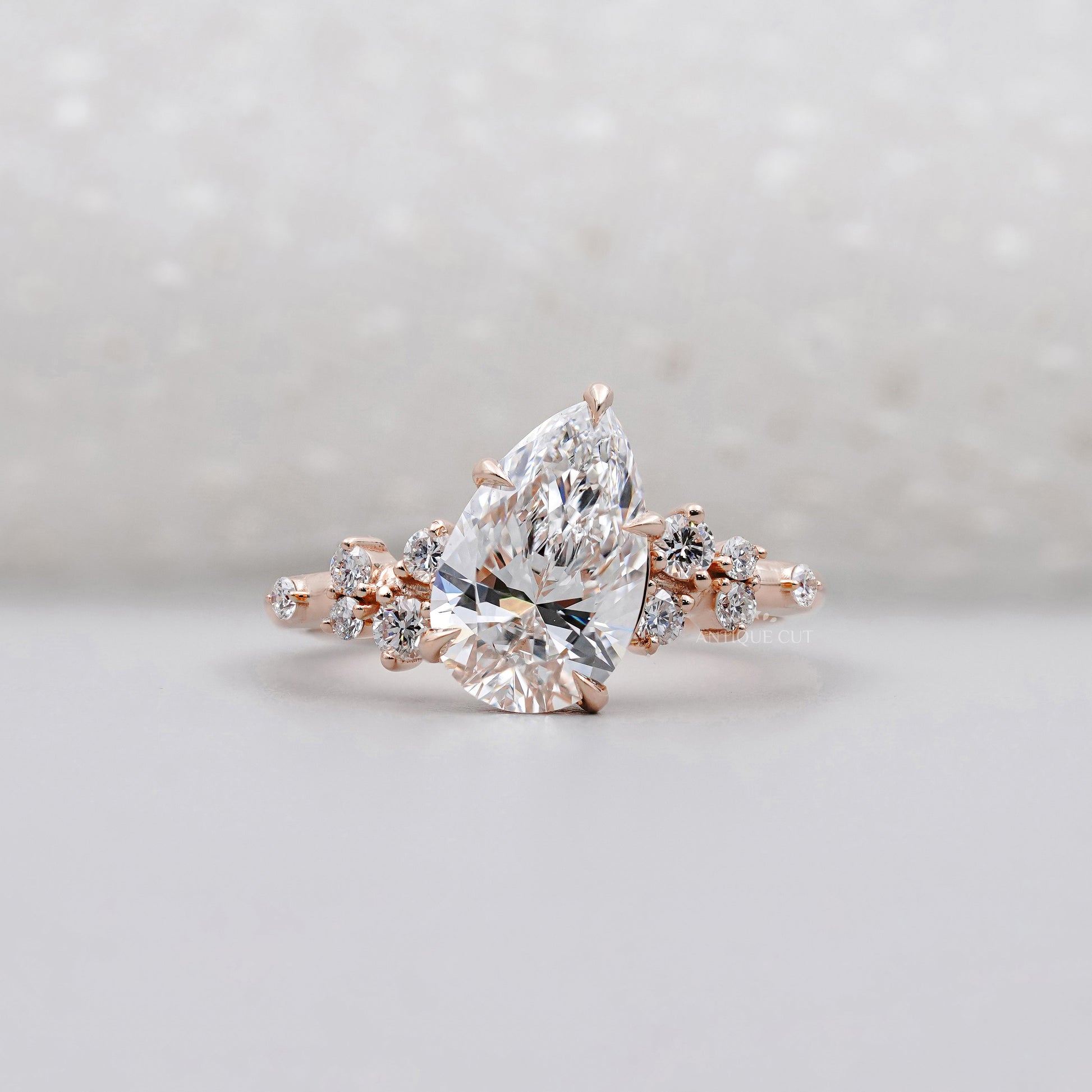 Pear Cut 2.30tcw Lab Diamond Engagement Ring | Rose Gold Cluster Side Stones IGI Certified