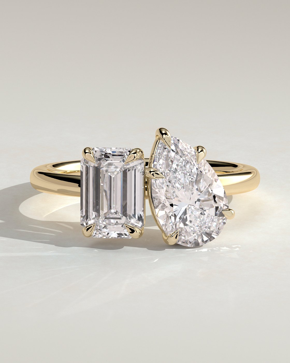 Yellow :: Orinora 1.8ct emerald and 1.5ct pear hidden halo toi et moi lab grown diamond engagement ring IGI certified yellow gold