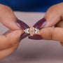 Common :: 1.00CT pink marquise lab grown diamond ring with an IGI-certified center stone.