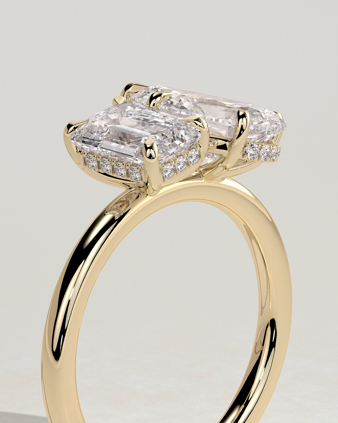 Yellow :: modern emerald and pear lab grown diamond toi et moi ring yellow gold elegant design