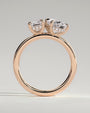 Rose :: close sparkle emerald and pear hidden halo ring rose gold warm tone
