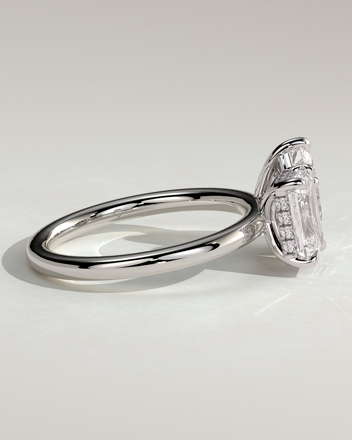 White :: close up emerald and pear hidden halo lab grown diamond ring white gold brilliant contrast