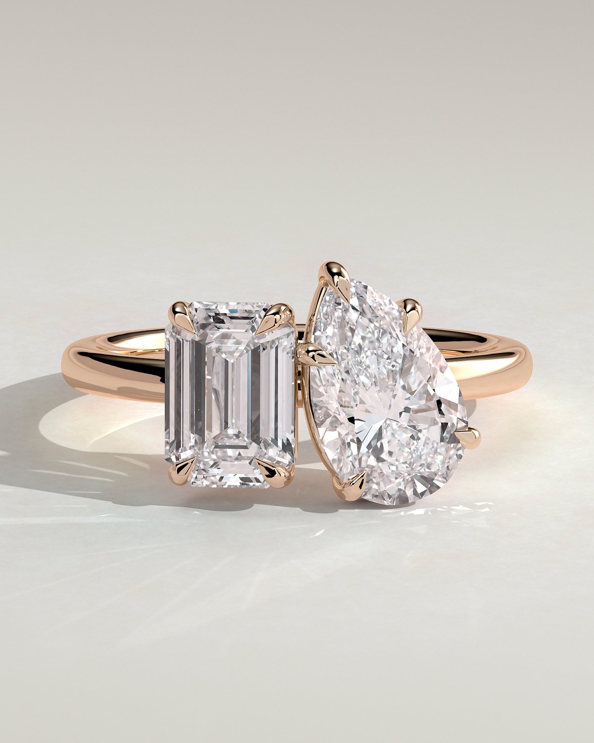 Rose :: Orinora 1.8ct emerald and 1.5ct pear hidden halo toi et moi lab grown diamond engagement ring IGI certified rose gold