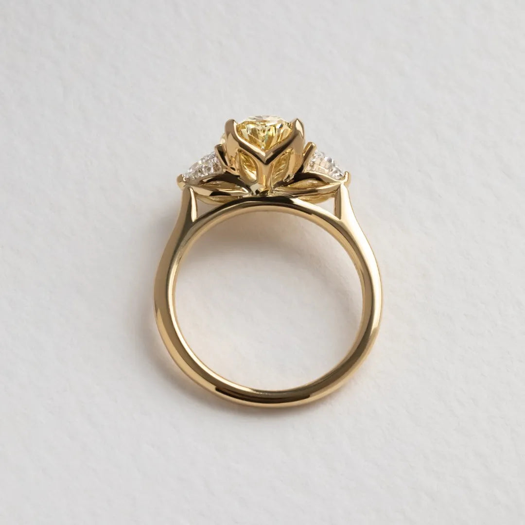 Common :: fancy yellow oval diamond ring trilogy engagement ring IGI certified