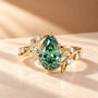 Common :: 2.20TCW green pear lab grown diamond nature-inspired engagement ring with round diamond accents.