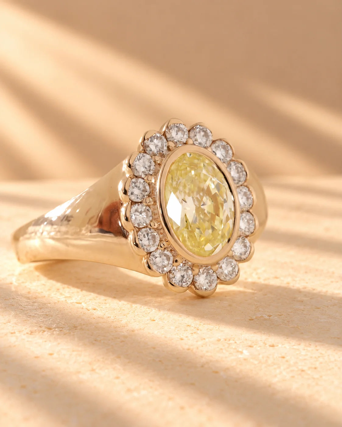 Common :: Yellow oval lab-grown diamond ring featuring an elegant halo design