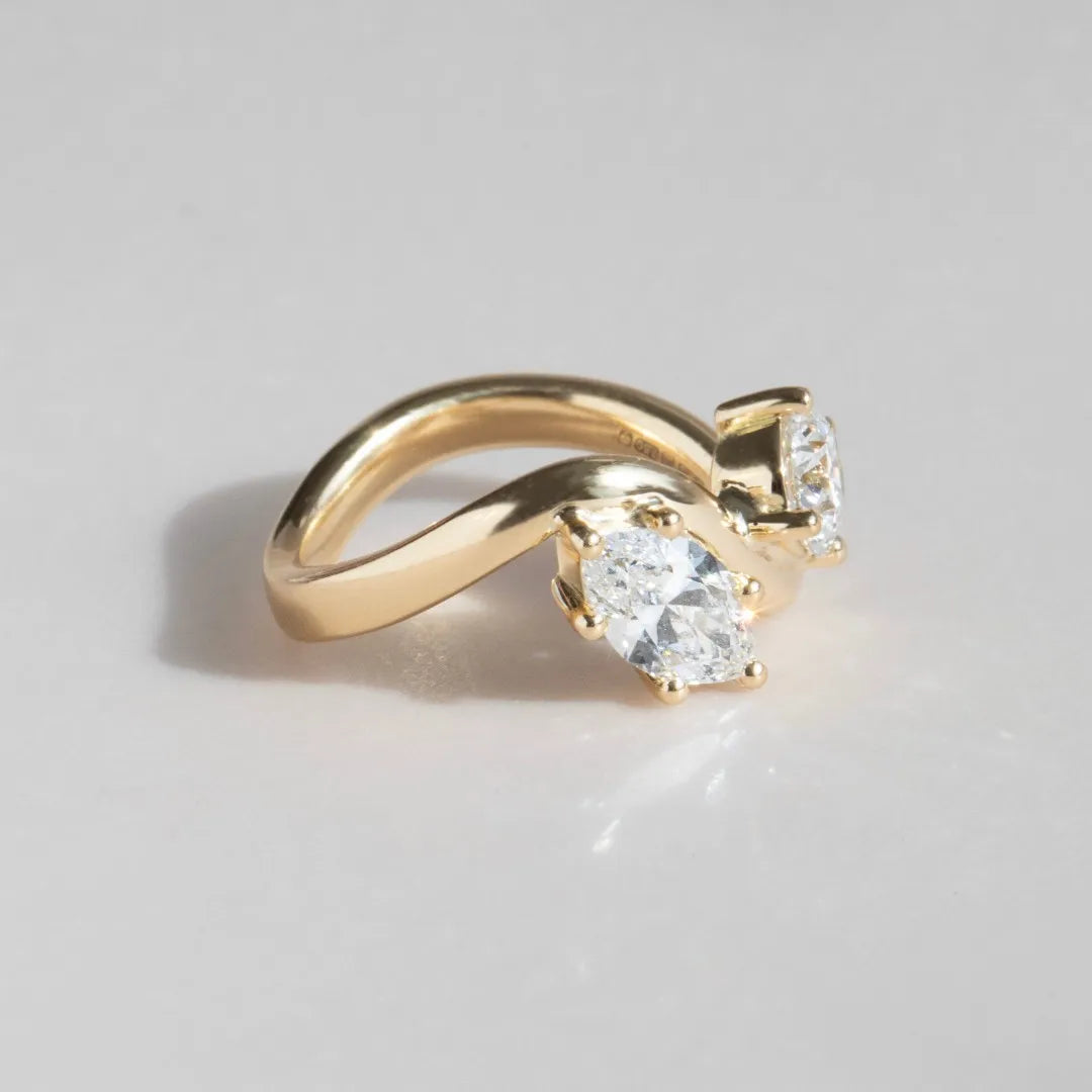 Common :: Elegant yellow gold engagement ring with premium D color VVS diamonds.