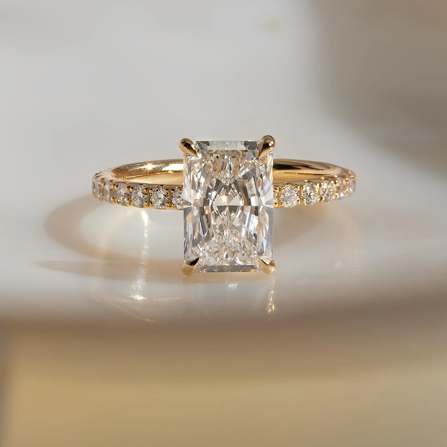 Common :: 2.52TCW radiant lab grown diamond hidden halo engagement ring with round diamond accents.