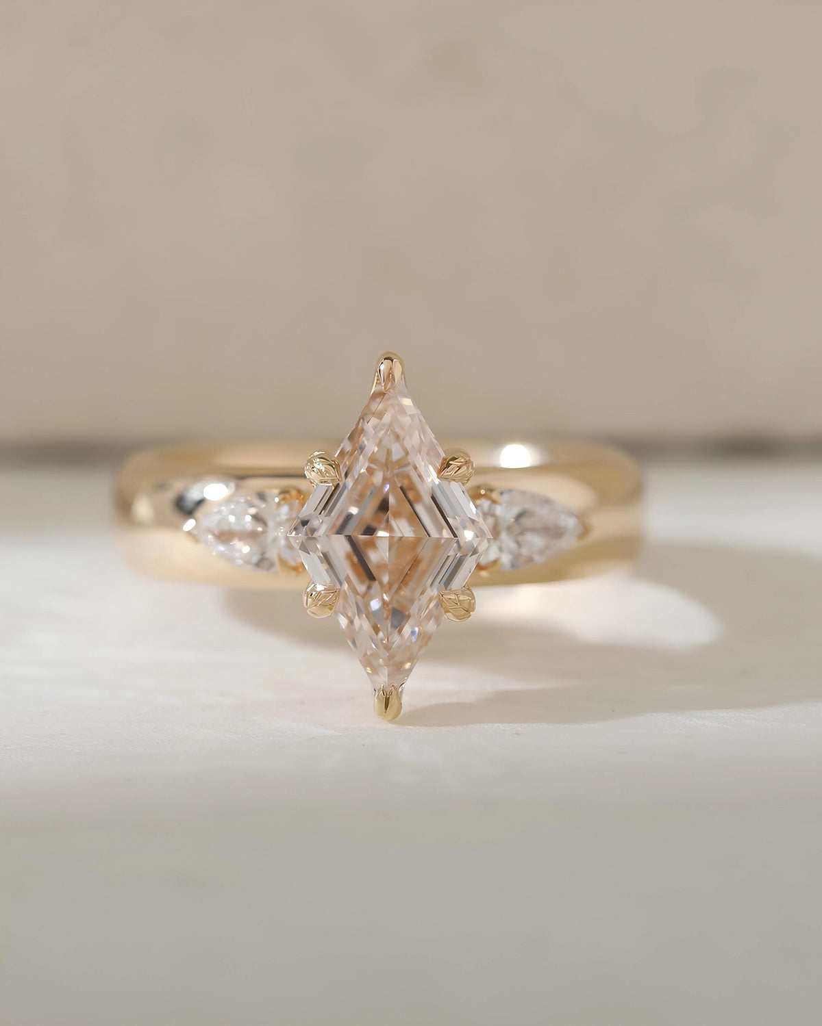 Common :: Unii Jewels 2.20TCW lozenge lab grown diamond three stone engagement ring