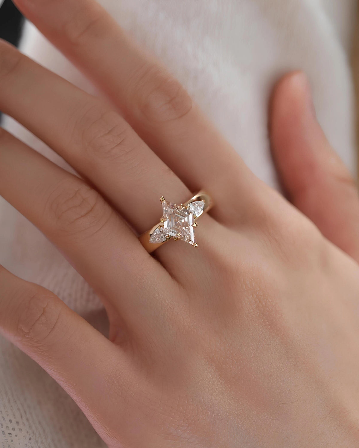 Common :: 2.00ct lozenge lab grown diamond ring with pear shaped side diamonds