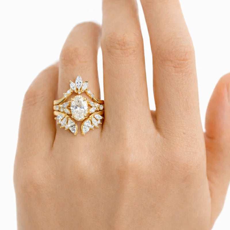 Common::  Close-up of a Gatsby-inspired lab grown diamond bridal ring set showcasing an emerald cut center diamond surrounded by brilliant pavé accents.