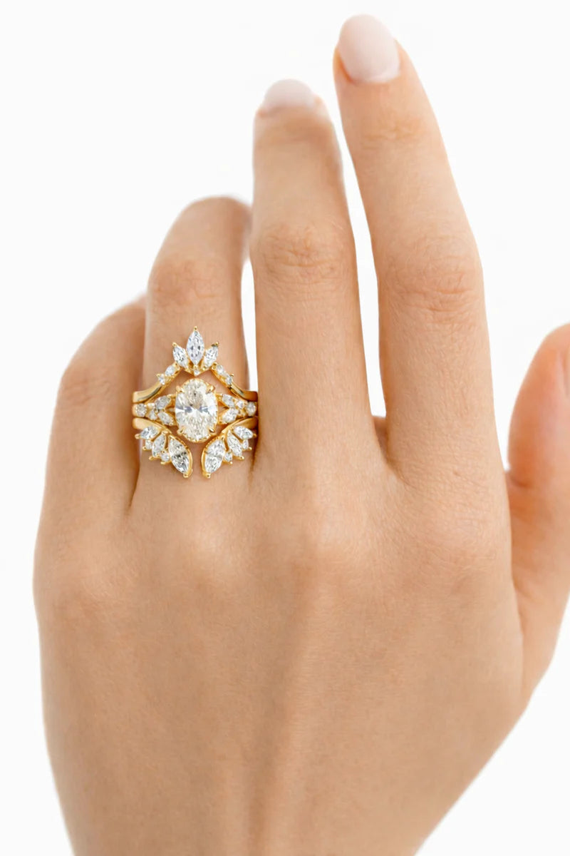 Common::  Close-up of a Gatsby-inspired lab grown diamond bridal ring set showcasing an emerald cut center diamond surrounded by brilliant pavé accents.