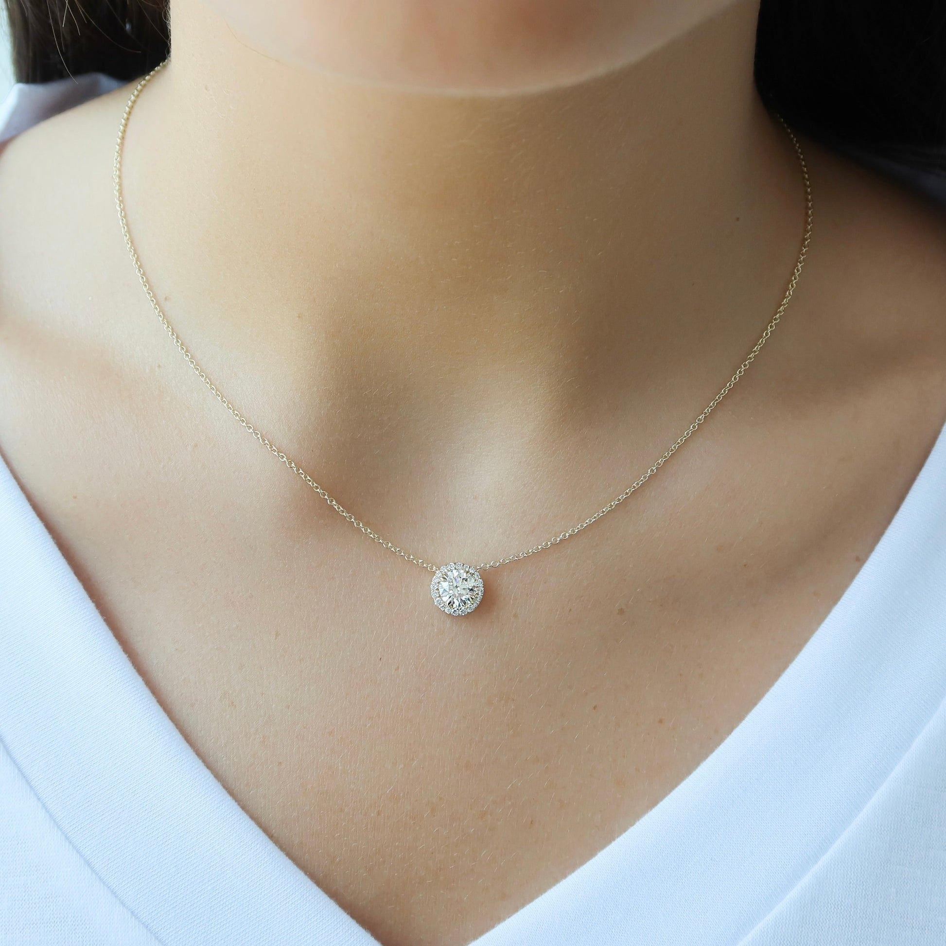yellow :: Arianza 0.8 CT oval lab grown diamond halo pendant necklace in polished yellow gold