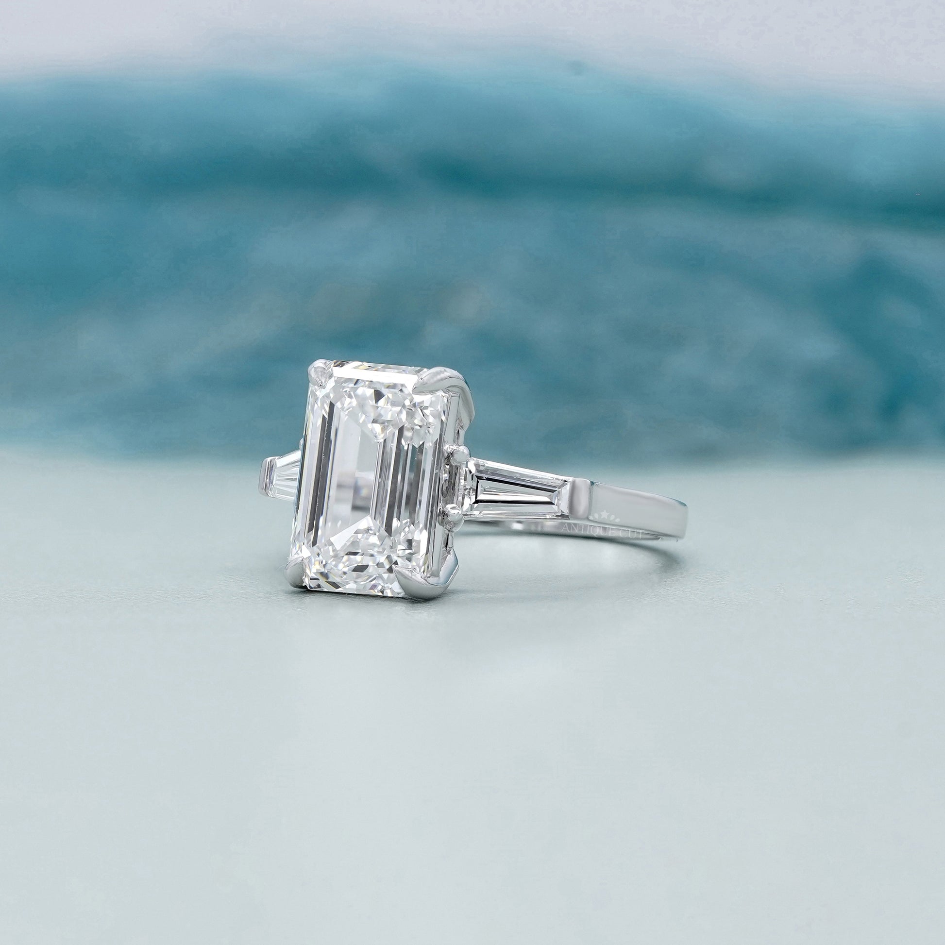 Emerald Cut 5.60tcw Lab Grown Diamond Three Stone Engagement Ring | Baguette Side Stones | Platinum/White Gold | IGI Certified