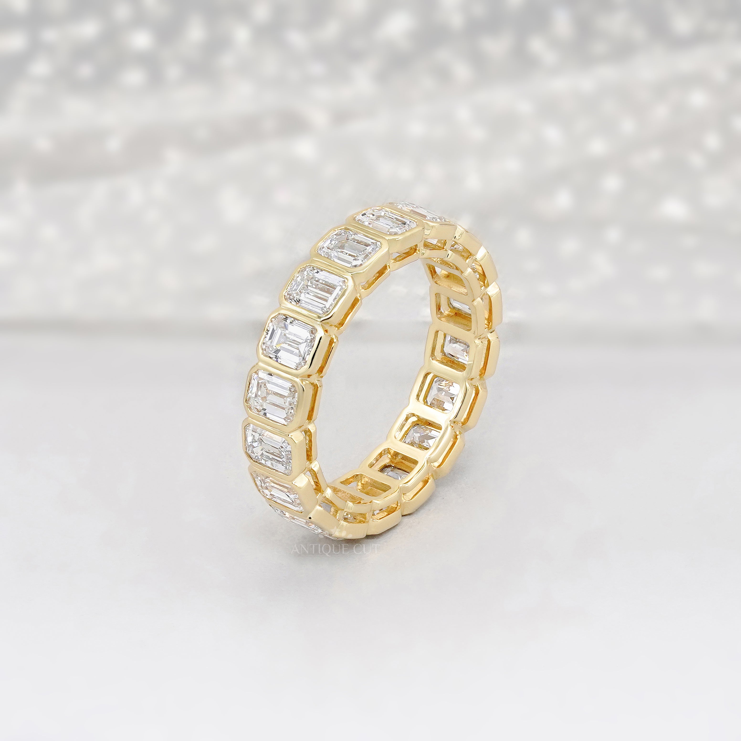 Emerald Cut 3.60tcw Lab Diamond Eternity Band | IGI Certified | Yellow Gold