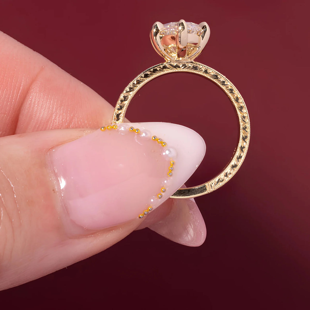Common :: Vintage-style lab grown diamond ring featuring an elongated marquise center stone.