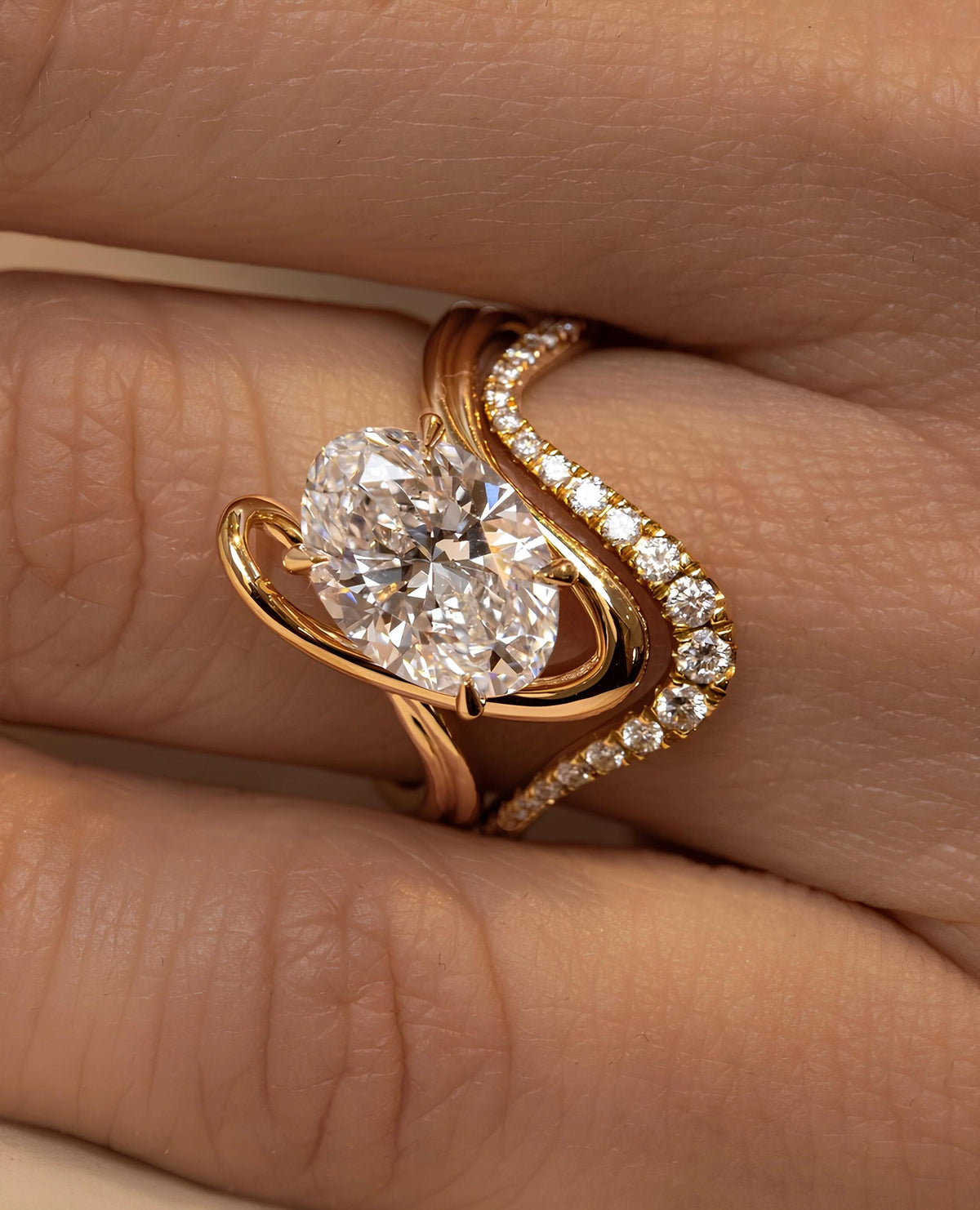 Common :: 2.00ct oval lab grown diamond solitaire ring with flowing metal design