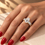 Common :: 2CT Pear Lab Grown Diamond Engagement Ring with Emerald side diamonds