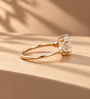 Common :: 2CT Pear center with 0.20TCW Round Lab Grown Diamond side stones