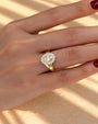 Common :: 2.00CT yellow oval center diamond in a halo-style engagement ring